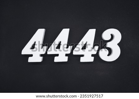 Black for the background. The number 4443 is made of white painted wood.