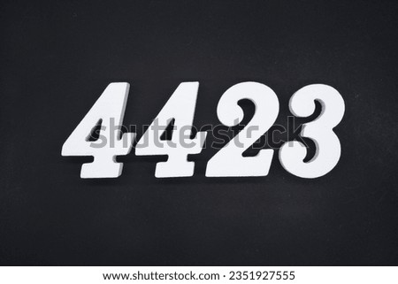 Black for the background. The number 4423 is made of white painted wood.