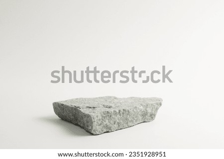 Gray flat textured stone pedestal on white background, template for mock-up, banner. Minimal concept, empty podium display product, presentation scene 
