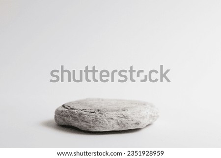 Gray flat textured stone pedestal on white background, template for mock-up, banner. Minimal concept, empty podium display product, presentation scene 
