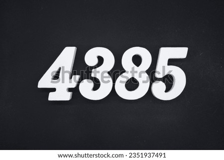 Black for the background. The number 4385 is made of white painted wood.