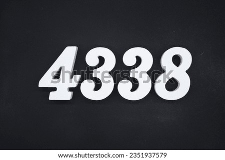 Black for the background. The number 4338 is made of white painted wood.