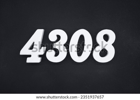 Black for the background. The number 4308 is made of white painted wood.