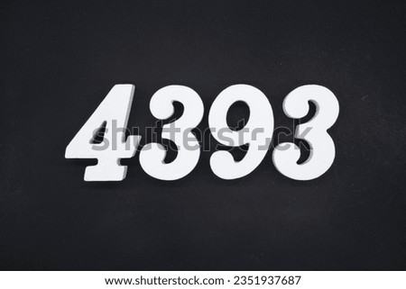 Black for the background. The number 4393 is made of white painted wood.