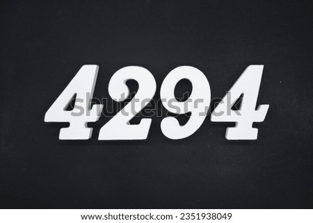 Black for the background. The number 4294 is made of white painted wood.