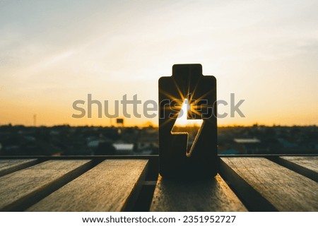 Technology battery high power electric energy with a connected charging cable. Battery to electric cars and mobile devices with clean electric, Green renewable energy battery storage future.	 Royalty-Free Stock Photo #2351952727