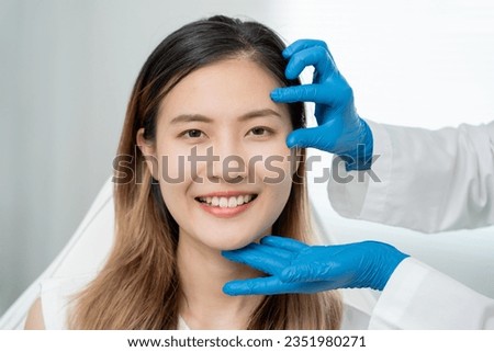 Cosmetic surgery, beauty, Surgeon or beautician touching woman face, surgical procedure that involve altering shape of eye, medical assistance, eyelid surgery, double eyelid, big eyes, ptosis Royalty-Free Stock Photo #2351980271