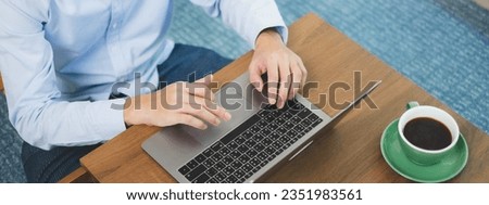 Hand typing on a laptop keyboard. With wireless technology, navigates internet, connecting for communication and gathering, study online information working, and marketing in the digital realm.