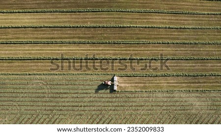 Tractor mowing the grass in the field