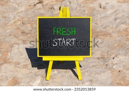 Fresh start and motivational symbol. Concept words Fresh start on beautiful black chalk blackboard on a beautiful stone background. Business motivational and Fresh start concept. Copy space.