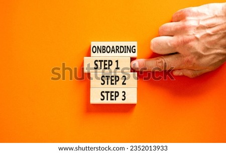Time to step 1 onboarding symbol. Concept words Onboarding step 1 on wooden block. Businessman hand. Beautiful orange table orange background. Business success step 1 onboarding concept. Copy space.