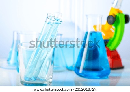 Chemical laboratory with glass test tubes and flasks.