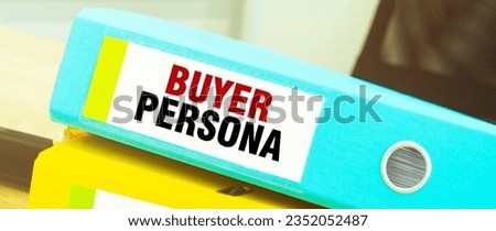 Two office folders with text BUYER PERSONA
