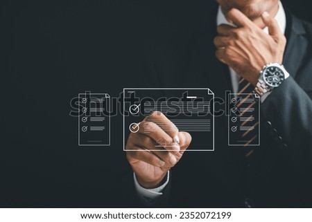 Businessman uses stylus pen to sign electronic documents on a digital screen. Illustrates the online signing process, digital document management, and the paperless concept. Agreement is established.