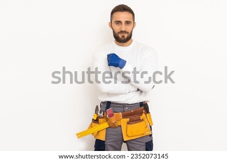 Man builder in a robe, overalls on a white background. Isolate, copy space