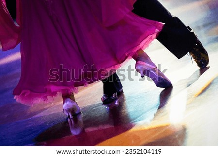 couple dancing standard dance on the dancefloor Royalty-Free Stock Photo #2352104119