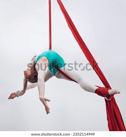 Aerial, woman gymnast and sport performance with stretching, flexibility and athlete with white background. Workout, exercise and gymnastics with balance, art and dance with acrobat competition