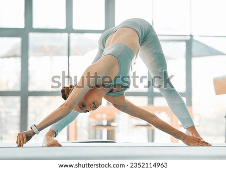 Yoga, gym or woman stretching body or ready to start gymnastics performance in training in studio. Fitness warm up, extended triangle pose or flexible girl in workout, practice or exercise in Texas