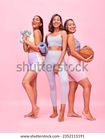 Sports, fitness and women in studio for yoga, training and exercise with ball, weights and mat. Friends, happy and people on pink background with gym equipment for wellness, workout and healthy body