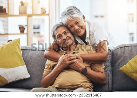 Portrait, hug and senior couple on sofa for bonding, healthy marriage and relationship in living room. Retirement, love and happy man and woman on couch embrace for trust, commitment and care at home