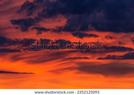 Clouds at the red evening sky after sunset, Germany