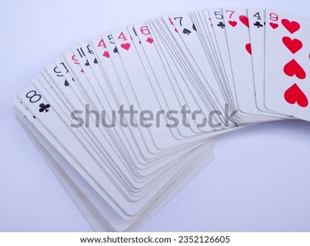 Stacks of playing cards or poker cards isolated on white background