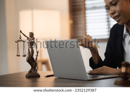 Justice and law concept. Law, legal judgement, courtroom gavel, African American attorney, lawyers discussing contract or business agreement at law firm office.