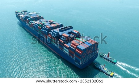 Stern ship. Cargo Container Ship carrying container and running with tug boat for import export goods from cargo yard port to custom ocean concept freight shipping 
