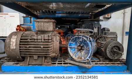 Piles of used electromotors are stored in a special rack Royalty-Free Stock Photo #2352134581