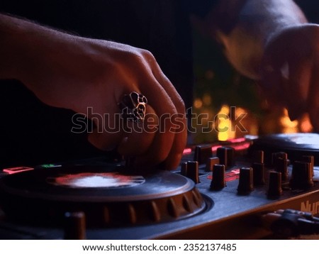 disk jokey performing electronical music Royalty-Free Stock Photo #2352137485