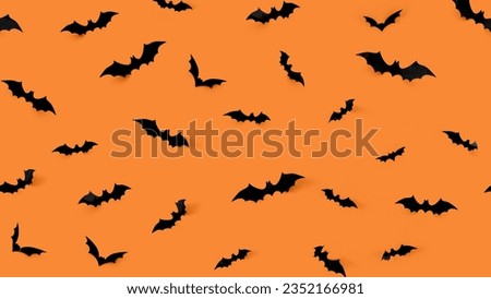 Bat Silhouette flying on deep saffron background, Wall Texture design, repeated and seamless pattern