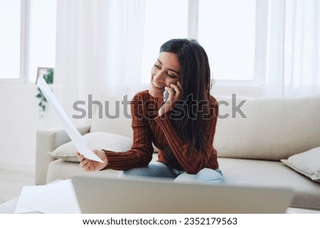 Woman smile talking on the phone, freelance work online with documents