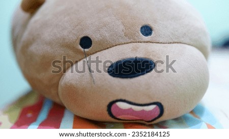thread crying brown bear face