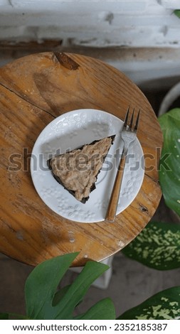 a slice of brownies cake on wooden table, flatlay