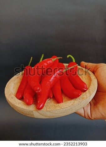 Photos of hot red chilies that can be used in pictures of recipe articles, herbs, spices, or visualization of hot chilies.