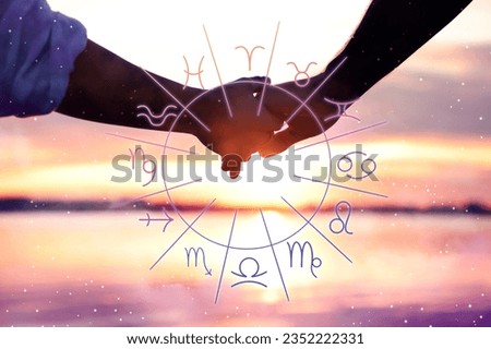 Relationships and horoscope. Zodiac wheel and photo of man and woman holding hands on beach, closeup
