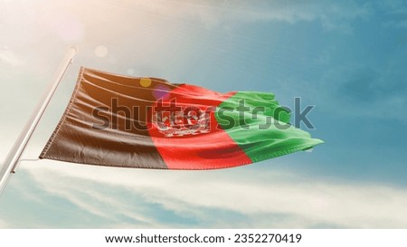 Afghanistan national flag waving in beautiful sky.