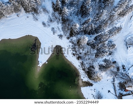 Magic and emotions of the Predil lake in a winter guise. Tarvisio. Top view