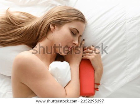 woman fall asleep with book stay in bed