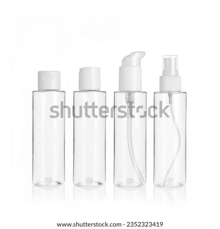 Group of PET cosmetic transparent bottles isolated on white background with disc top cap, flip cap, lotion pump and spray pump. Packaging of bottles for cosmetics and medical products.