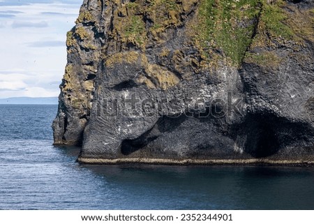 Elephant rock, a grass-covered elephant head shaped rock above the sea
