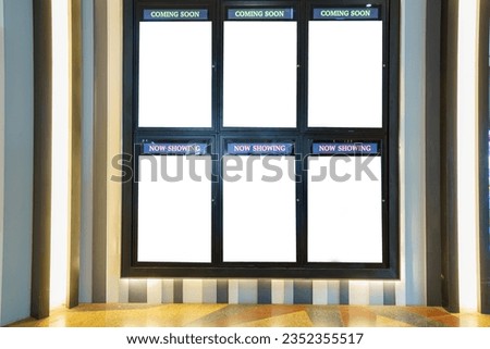 In the theater walkway, an empty billboard cinema poster panel stands ready, a white blank mockup movie frame with "Coming Soon" text, inviting your design to shine.