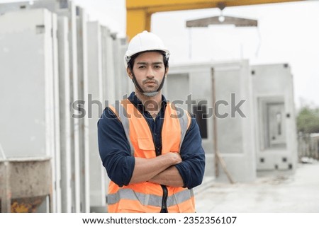 Foreman construction builder worker wearing safety uniform, helmet working at construction site