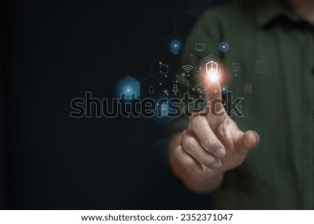 Businessman touches a virtual screen in the concept of networking and connecting, copy space for text. Royalty-Free Stock Photo #2352371047