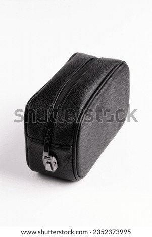 Leather black pouch. Style luggage on white background