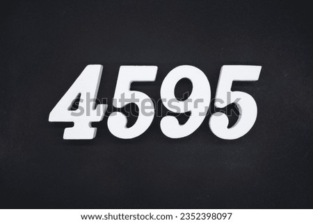 Black for the background. The number 4595 is made of white painted wood.