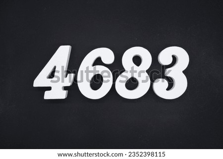 Black for the background. The number 4683 is made of white painted wood.