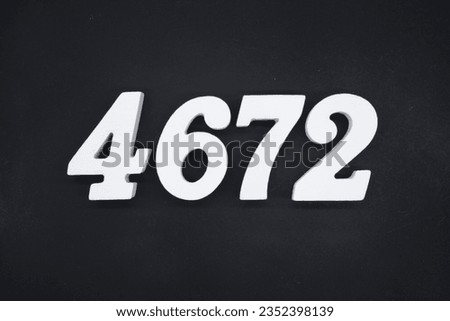 Black for the background. The number 4672 is made of white painted wood.