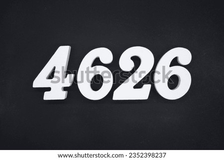 Black for the background. The number 4626 is made of white painted wood.