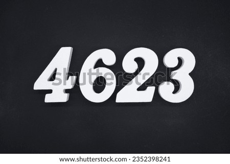 Black for the background. The number 4623 is made of white painted wood.